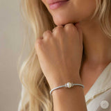 Silver bangle with zirconia and pearl