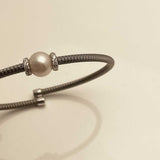 Silver bangle with zirconia and pearl