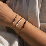 Multi armring i silver med Tigeröga topp