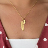 Feather pendant medium in silver with diamond