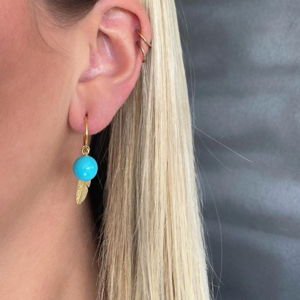 Creol with turquoise and feather